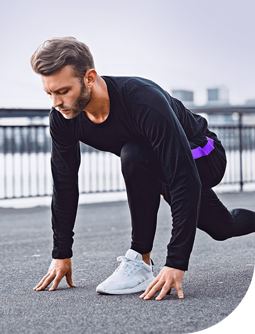 A man getting ready to run